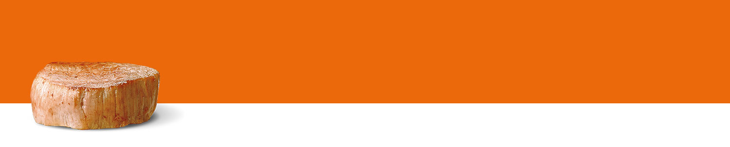 A cylindrical wooden object stands against a split background of orange and white.