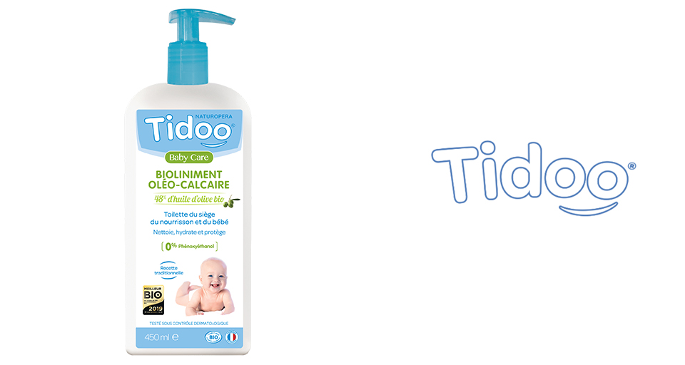 Un flacon blanc avec un distributeur à pompe bleu, étiqueté "Tidoo Baby Care", contient un produit de soins pour bébés d'un volume de 450 ml.