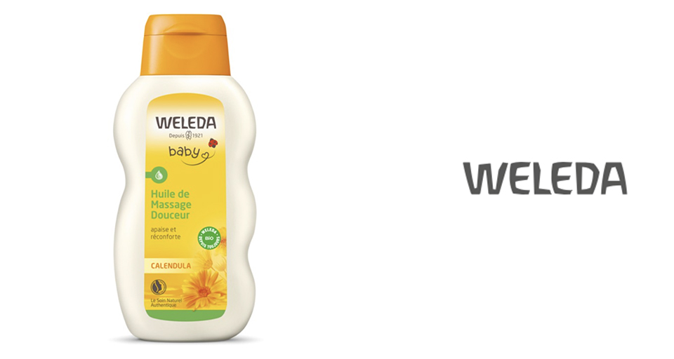 Un flacon d'huile de massage pour bébé Weleda au calendula, accompagné du logo Weleda.
