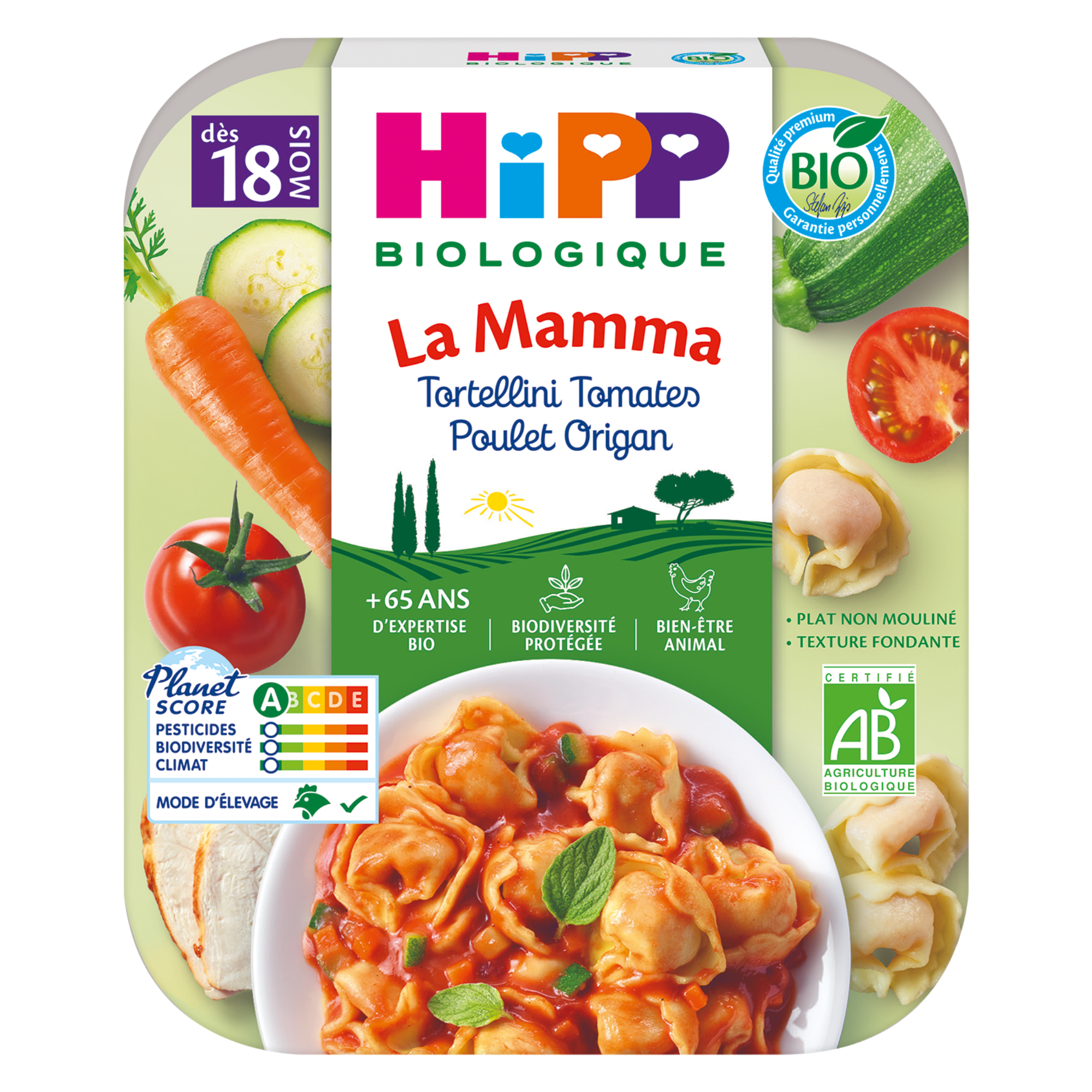 Un produit alimentaire emballé dont l'étiquette porte la mention "Hipp Biologique", indiquant qu'il s'agit d'un produit biologique de la marque Hipp. Le produit s'appelle "La Mamma" et contient des tortellini à la sauce tomate et au poulet. L'emballage comporte également un Planet Score, qui suggère une évaluation de l'impact sur l'environnement, et divers logos de certification.